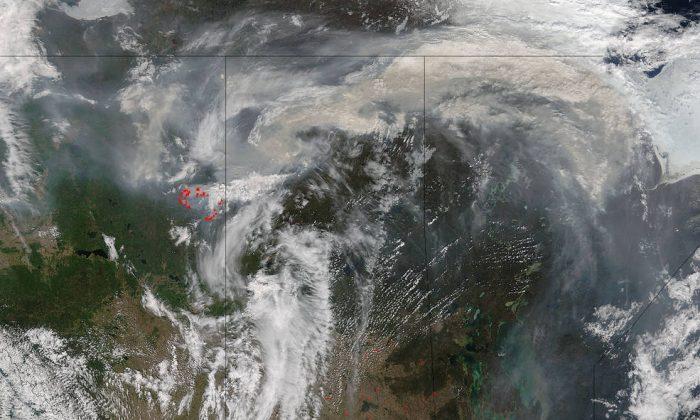 NASA Satellite Images Show Magnitude of Fort McMurray Fire as It Destroys Oilsands Camp