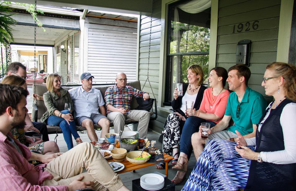 Joanna Taft (4th R) hosts a porching party at her house. (Annie Wu/Epoch Times)