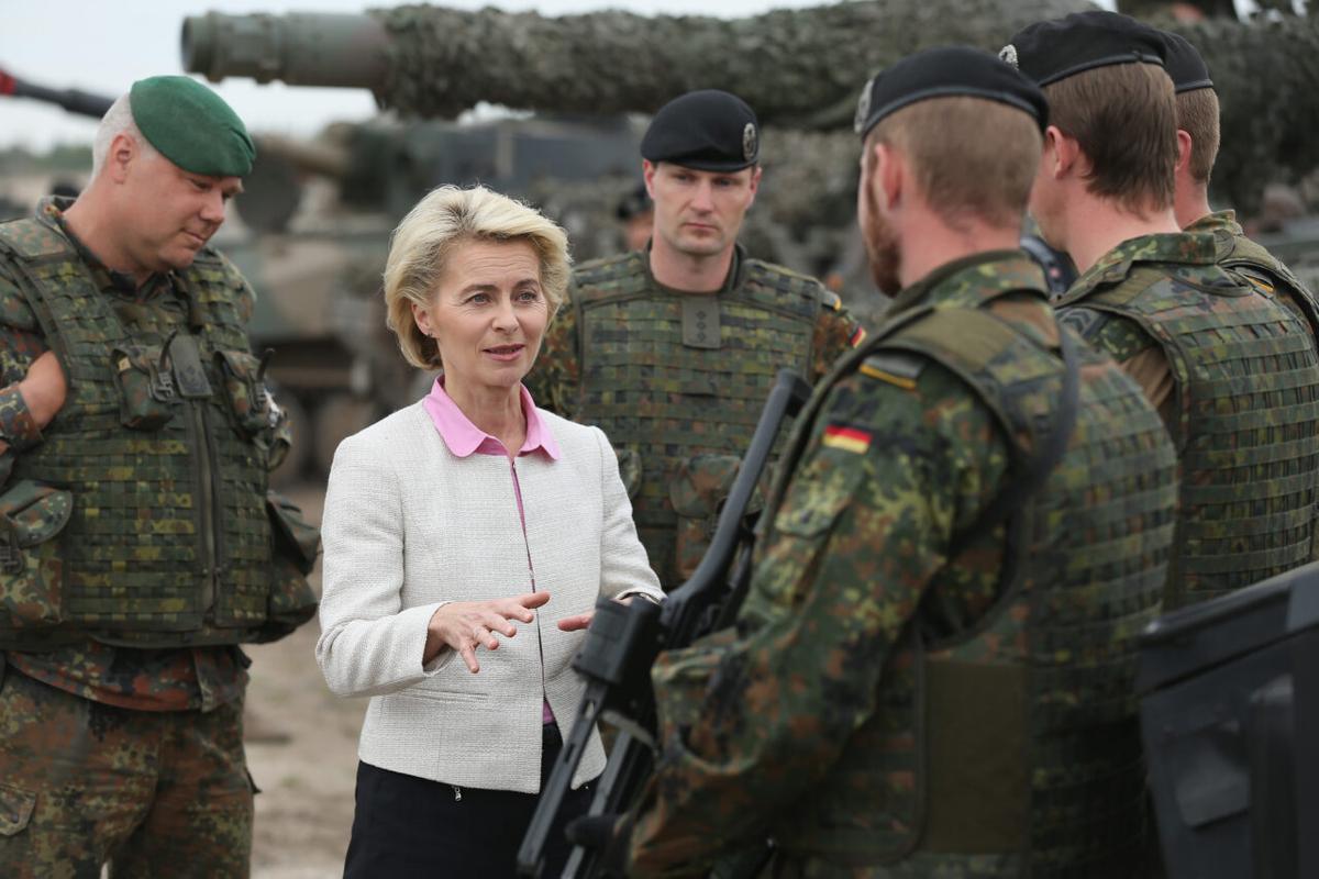 German Defence Minister Ursula von der Leyen chats with troops of the German armed forces, the Bundeswehr, while attending the NATO Noble Jump military exercises of the VJTF forces in Zagan, Poland, on June 18, 2015. (Sean Gallup/Getty Images)