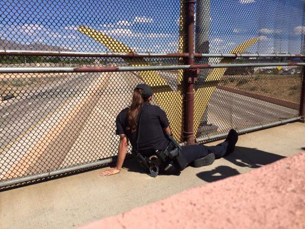 "I tried to stay as calm as I could, but to see someone hanging off a bridge, your stomach does drop, you feel that gut feeling," Madrid said, adding that she first had to try and gain the man's trust. (Albuquerque Police Department)