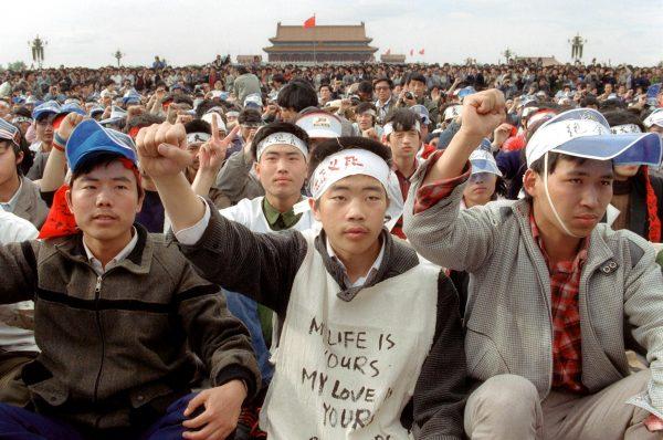 Students from Beijing University gather with thousands of other during a huge demonstration at Tiananmen Square as they start a hunger strike as the part of mass pro-democracy protest against the Chinese regime, China, on May 18, 1989. (Catherine Henriette/AFP/Getty Images)