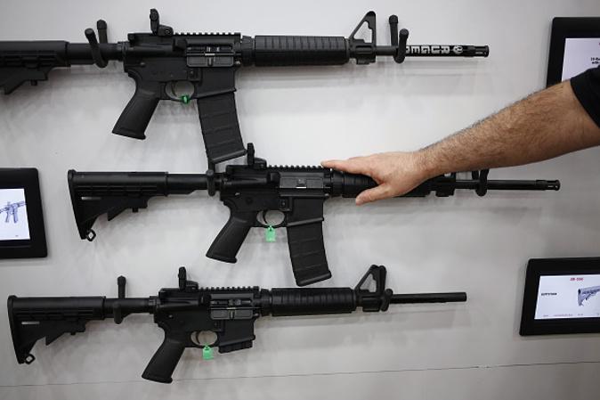 AR-15 rifles are displayed on the exhibit floor during the National Rifle Association (NRA) annual meeting in Louisville, Kentucky, U.S., on Friday, May 20, 2016. (Luke Sharrett/Bloomberg)