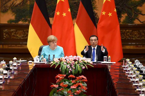 German Chancellor Angela Merkel (L) listens to Chinese Premier Li Keqiang during a meeting at the Great Hall of the People in Beijing, China, on June 13, 2016. (Wang Zhao/Pool Photo/AP)