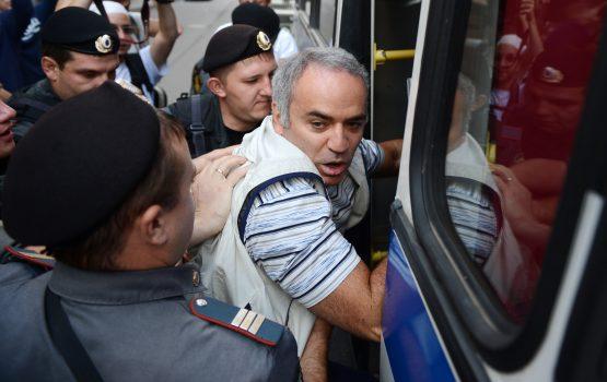 Russian riot police officers detain former world chess champion Garry Kasparov, outside a court building in Moscow on August 17, 2012. (ANDREY SMIRNOV/AFP/GettyImages)