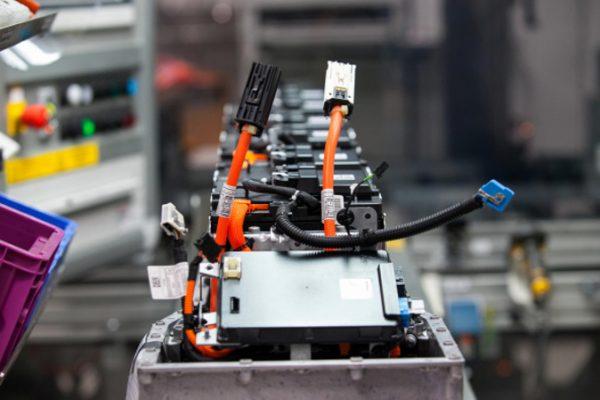 Cables and lithium-ion battery components sit on the production line at the Bayerische Motoren Werke AG (BMW) automobile manufacturing plant in Dingolfing, Germany, on Thursday, Aug. 21, 2014. (Krisztian Bocsi/Bloomberg via Getty Images)