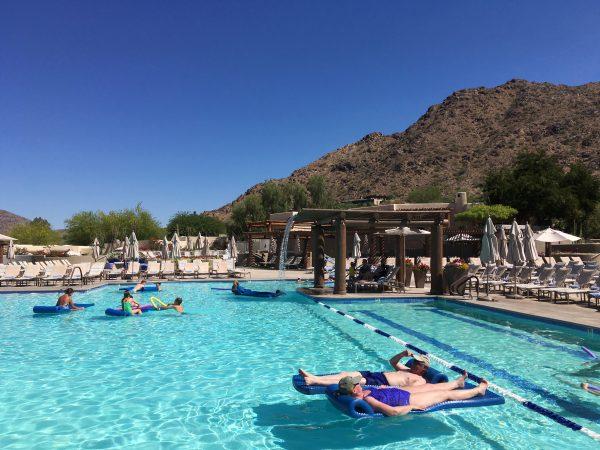 Hotel guests cool off at the pool at the JW Marriott Scottsdale Camelback Inn Resort and Spa in Paradise Valley, Ariz., on Sunday, June 19, 2016. States in the Southwest are in the midst of a summer heat wave as a high-pressure ridge bakes Arizona, California, and Nevada with extreme, triple-digit temperatures. (AP Photo/Anna Johnson)