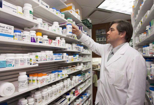 Pharmacist Denis Boissinot at his pharmacy in Quebec City, March 8, 2012. A new study says Canada urgently needs a national strategy to ensure people over 65 are prescribed appropriate medications. (The Canadian Press/Jacques Boissinot)