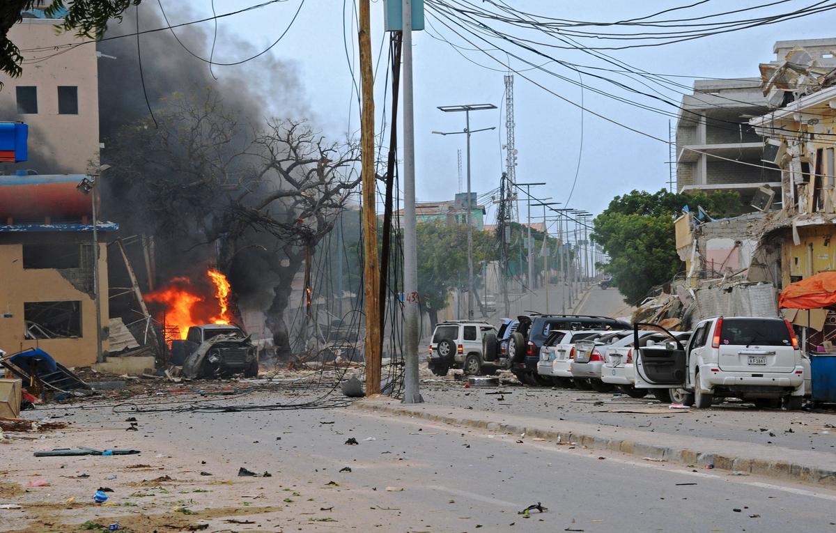 Fire is seen at the scene of a car bomb attack claimed by al-Qaeda-affiliated al-Shabaab militants on the Naasa Hablood hotel in Mogadishu on June 25, 2016. (Mohamed Abdiwahab/AFP/Getty Images)