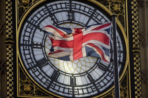 The Union Kingdom flag flaps in the wind in front of the Great Clock atop the landmark Elizabeth Tower that houses Big Ben at the Houses of Parliament in central London on Sept. 26, 2014. (Justin Tallis/AFP/Getty Images)