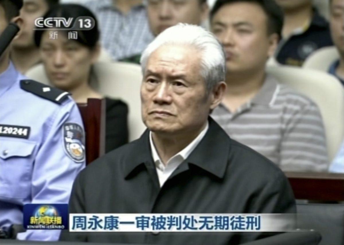 Zhou Yongkang, the former Chinese Communist Party Politburo Standing Committee member in charge of security, sits in a courtroom at the First Intermediate People's Court of Tianjin in Tianjin, China, on June 11, 2015. (CCTV via AP Video)