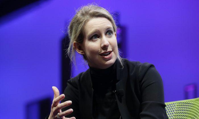 Feds Ban Theranos CEO Holmes From Running Lab for 2 Years