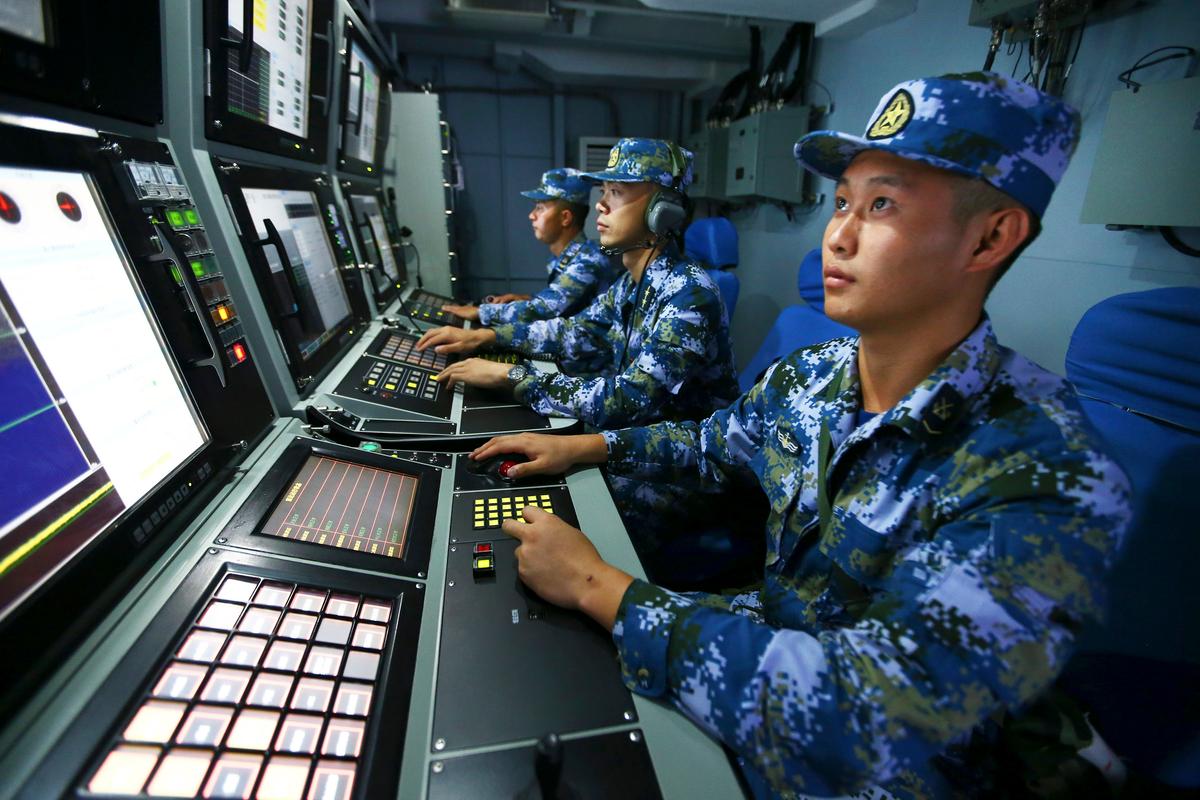 Chinese navy sailors search for targets onboard the missile destroyer Hefei during a military exercise in the waters near south China's Hainan Island and Paracel Islands on July 8, 2016. (Zha Chunming/Xinhua via AP)