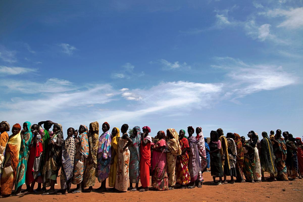 Internally displaced people (IDPs) recently arrived to Wau, South Sudan, due to armed clashes in surrounding villages, wait to be registered by the International Organization for Migration (IOM) and the World Food Program (WFP) on May 11, 2016. (Albert Gonzalez Farran/AFP/Getty Images)