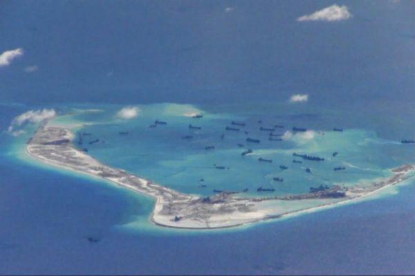 Chinese dredgers work on the construction of artificial islands on and around Mischief Reef in the Spratly Islands of the South China Sea on May 2, 2015. (U.S. Navy)