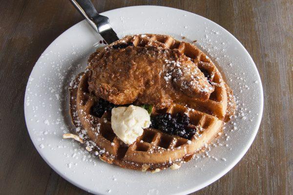The Chicken and Waffles dish at Elm City Social is elevated with whipped whiskey butter and<br/>blackberry jam. (Annie Wu/Epoch Times)