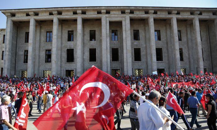 Turkey Fires 24,000 Teachers, Police in Coup Plotters Hunt