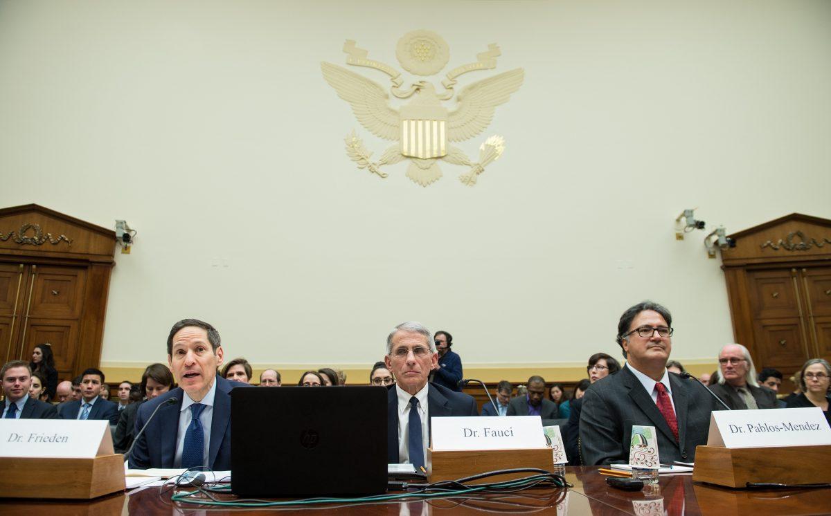 Former Centers for Disease Control and Prevention Director Tom Frieden (L), Anthony Fauci (C), and Ariel Pablos-Mendez, assistant administrator of the U.S. Agency for International Development's Bureau for Global Health on a Feb. 10, 2016. (Nicholas Kamm/AFP/Getty Images)