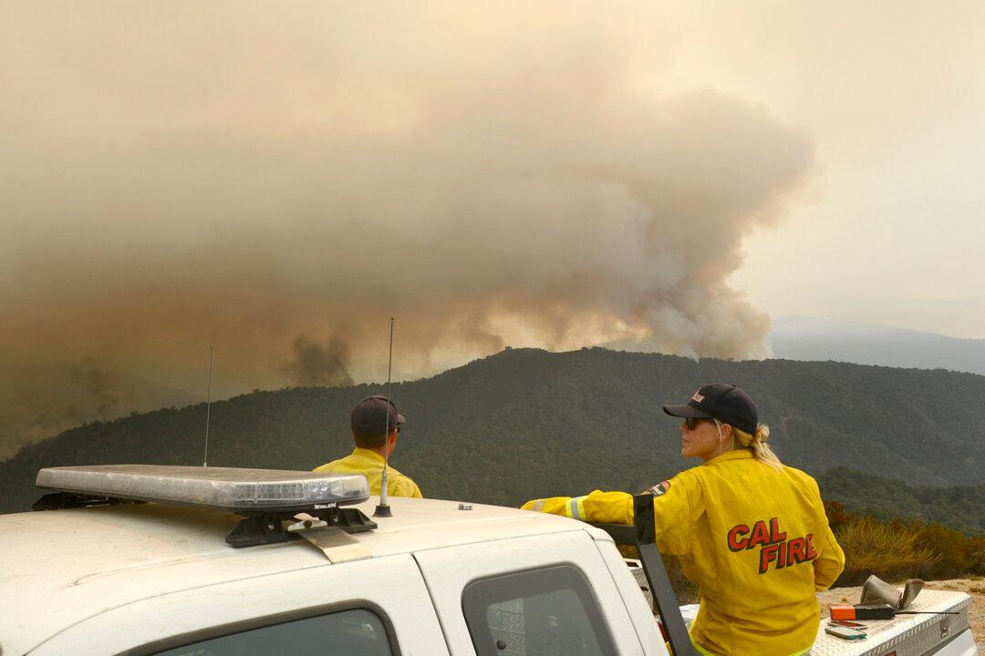 Wildfires Burn in 7 Western States, Prompt Evacuations
