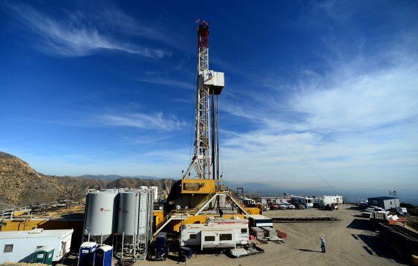 Crews work on stopping a methane gas leak at a well in Aliso Canyon near the Porter Ranch area of Los Angeles County in December 2015, the then-largest methane gas leak in the nation’s history. (Dean Musgrove/Los Angeles Daily News via AP)