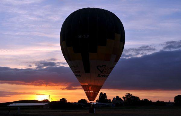 A hot-air-balloon prepares to take off for the launch of the France Ballooning Championship in Mirebeau, France, on Aug. 10, 2016. (Guillaume Souvant/AFP/Getty Images)