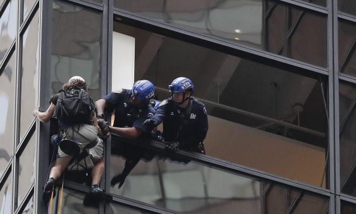 Man Scales Facade of Trump Tower; Police Grab Him