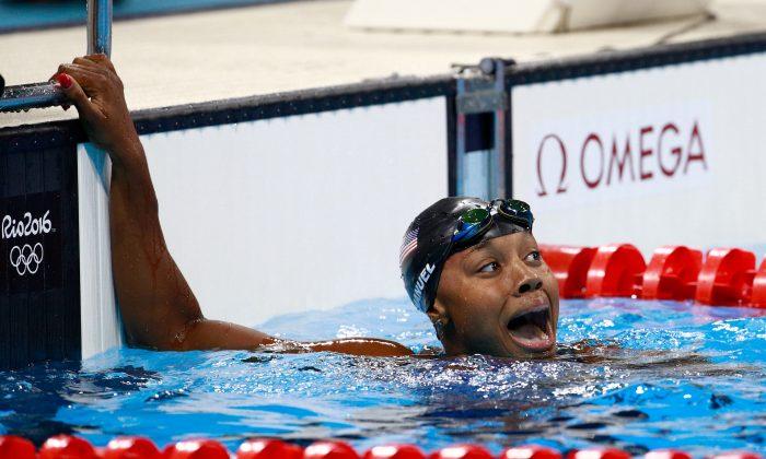Manuel Becomes 1st African American Woman to Win Swim Gold
