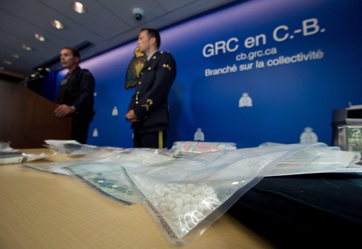 Fake Oxycontin pills containing fentanyl are displayed during a news conference at RCMP headquarters in Surrey, British Columbia, Canada, on Sept. 3, 2015. (Darryl Dyck/The Canadian Press)