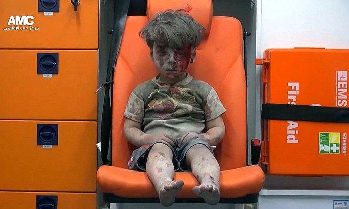 Haunting Image of Syrian Boy Rescued From Aleppo Airstrike Rubble