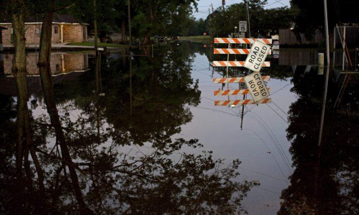 Search for Living, Dead: Louisiana Fights Back From Flooding