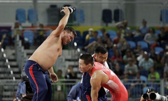 Mongolian Wrestling Coaches Strip Down in Public Protest at Rio Olympics