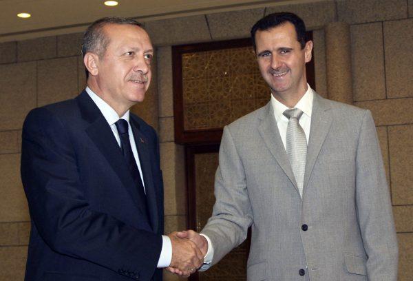 Syrian President Bashar Assad (R) shakes hands with then Turkish Prime Minister Recep Tayyip Erdogan, at al-Shaab presidential palace in Damascus, Syria, in this 2010 file photo. (Bassem Tellawi/AP Photo)