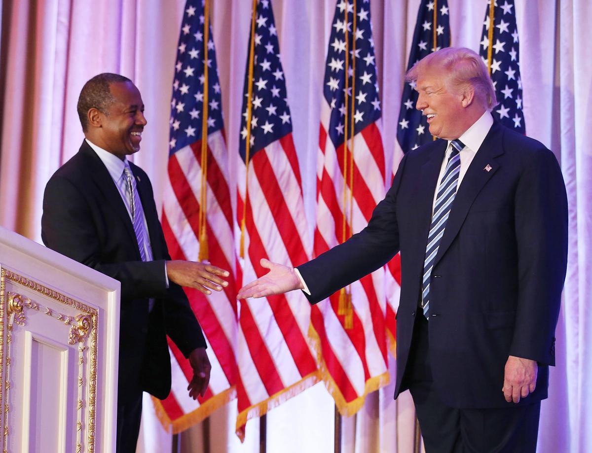 Then Republican presidential candidate Donald Trump with former presidential candidate Ben Carson as he receives his endorsement at the Mar-A-Lago Club in Palm Beach, Fla., on March 11, 2016. (Joe Raedle/Getty Images)