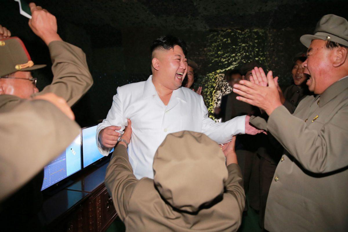In this undated photo distributed on Thursday, Aug. 25, 2016, by the North Korean government, North Korean leader Kim Jong Un, center, visits the site of a submarine-launched missile test at an undisclosed location in North Korea.  (Independent journalists were not given access to cover the event depicted in this image distributed by the Korean Central News Agency via Korea News Service.) (Korean Central News Agency/Korea News Service via AP)