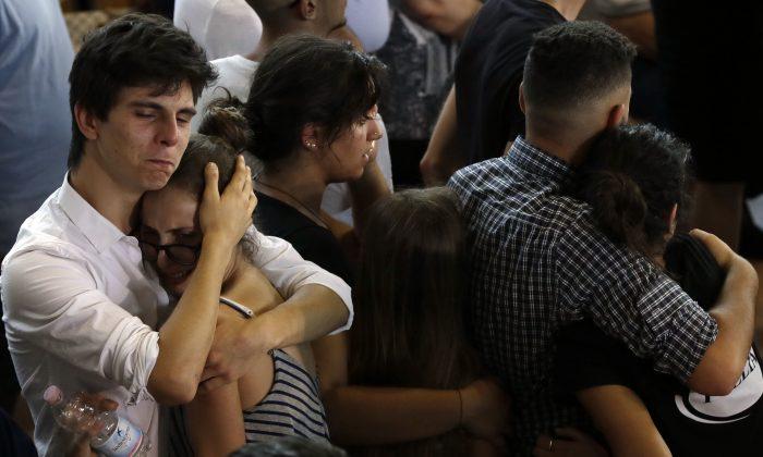 Italy Buries Quake Dead, Recalls Sisters Embracing in Rubble