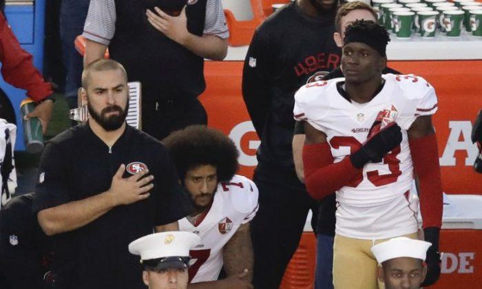 Kaepernick, 49ers Teammate Kneel During National Anthem