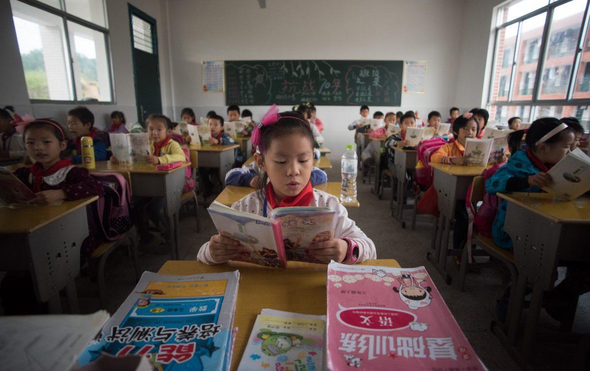Chinese schoolchildren attend class at the Shiniuzhai Puan Center Primary School in Pingjiang County in China's Hunan Province, on the first day back to school after the national holidays, on Oct. 8, 2015. (Johannes Eisele/AFP/Getty Images)