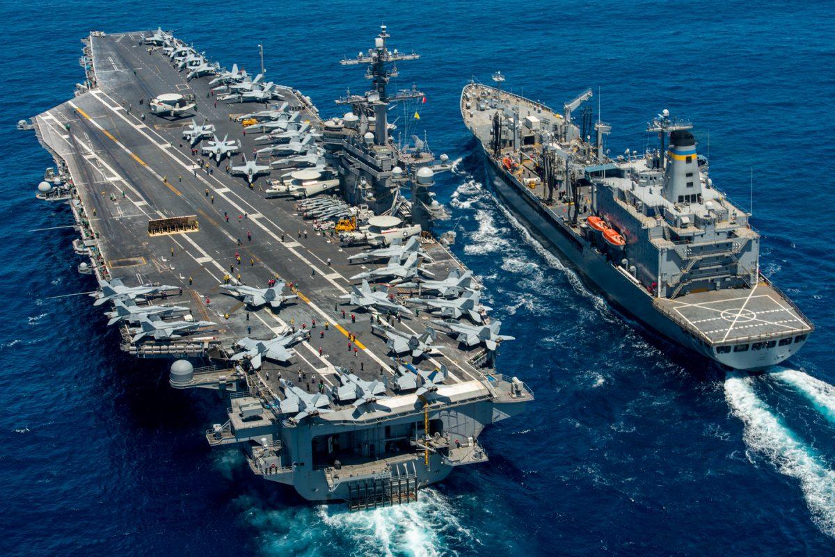 The aircraft carrier USS Carl Vinson (CVN 70) conducts a replenishment-at-sea with the fleet replenishment oiler USNS Yukon (T-AO 202) in the Pacific Ocean on July 26, 2016. (U.S. Navy Mass Communication Specialist 2nd Class Patrick W. Menah Jr./U.S. Navy)