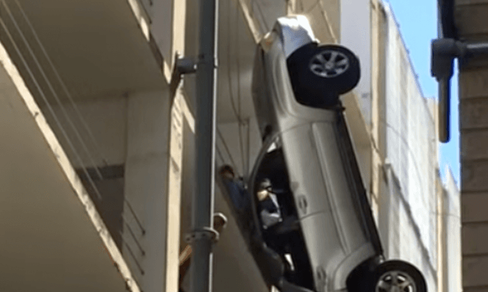 Vehicle Dangles From Parking Garage in Austin, Texas