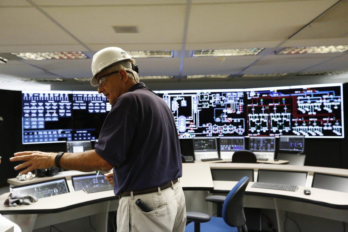 In this Sept. 7, 2016 photo, site manager Jim Chardos shows the media the control room at the Bellefonte Nuclear Plant, in Hollywood, Ala. (AP Photo/Brynn Anderson)