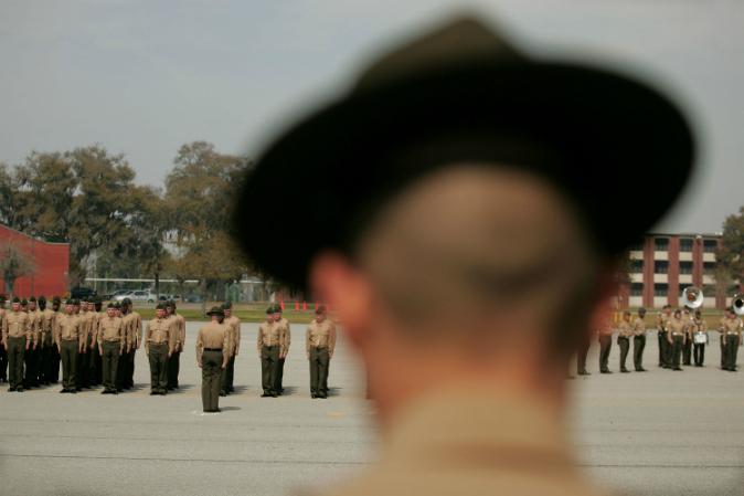 A U.S. Marine Corps drill instructor watches recruits on the parade deck during boot camp on March 8, 2007, at Parris Island, S.C. (Scott Olson/Getty Images)