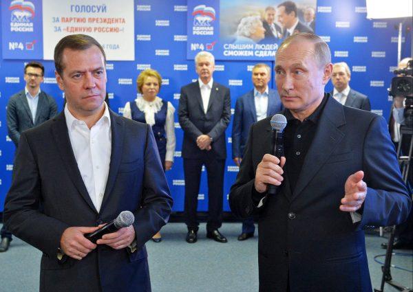 Russian President Vladimir Putin, right, and Russian Prime Minister Dmitry Medvedev, left, speak at the United Party's election headquarters in Moscow on Sept. 18, 2016. (Alexei Druzhinin/Sputnik, Kremlin Pool Photo via AP)