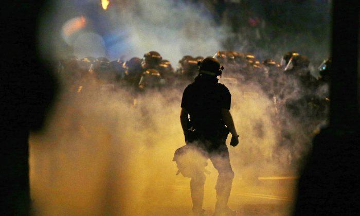 Report: Charlotte Rioters Try to Throw Photographer into Fire