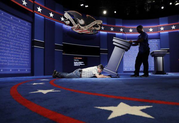 Technicians set up the stage for the presidential debate between Democratic presidential candidate Hillary Clinton and Republican presidential candidate Donald Trump at Hofstra University in Hempstead, N.Y., Sunday, Sept. 25, 2016. (Patrick Semansky/AP Photo)