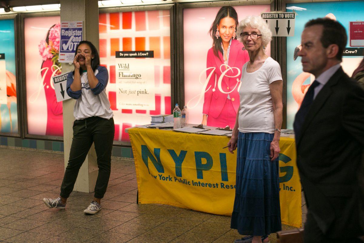 Staff from the student-directed research and advocacy organization, New York Public Interest Research Group, try to register new voters at the Times Square subway station in New York on Sept. 27, 2016. (Benjamin Chasteen/Epoch Times)