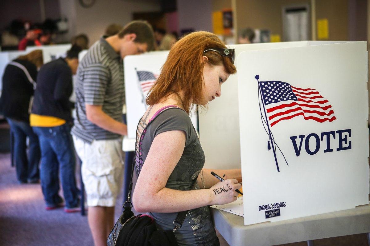 A student votes on the campus of the University of Northern Iowa in Cedar Falls, Iowa, during the 2012 election. (Scott Olson/Getty Images)