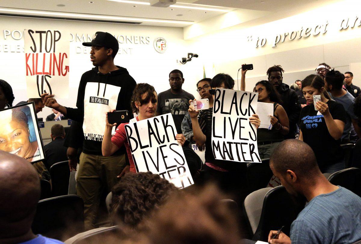 Activists hold "Black Lives Matter" signs in a file photo. (AP Photo/Nick Ut)