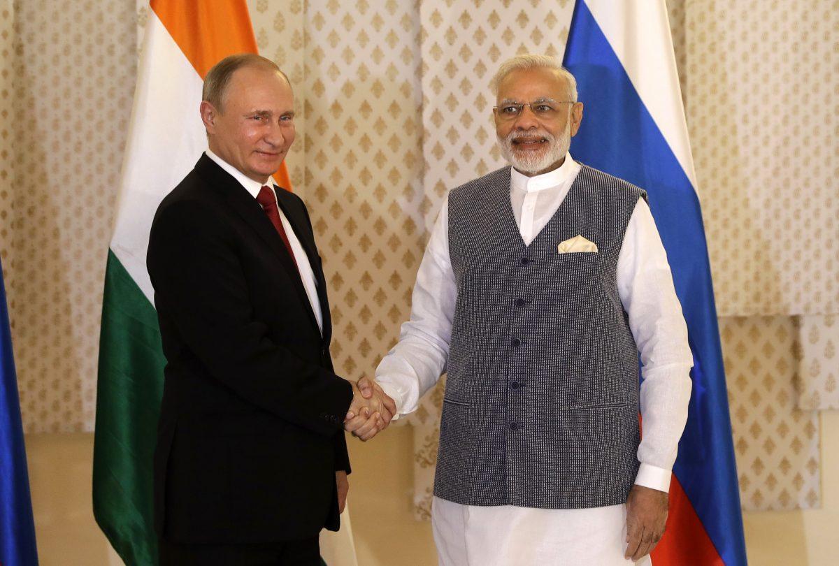 Indian Prime Minister Narendra Modi (R) shakes hand with Russian President Vladimir Putin prior to their annual bilateral meeting, on the sidelines of the BRICS summit, where they are expected to discuss Syria and Afghanistan, in Goa, India, on Oct. 15, 2016. (AP Photo/Manish Swarup)