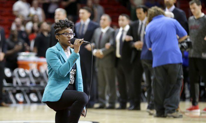 Anthem Singer at Heat-76ers Game Kneels During Performance