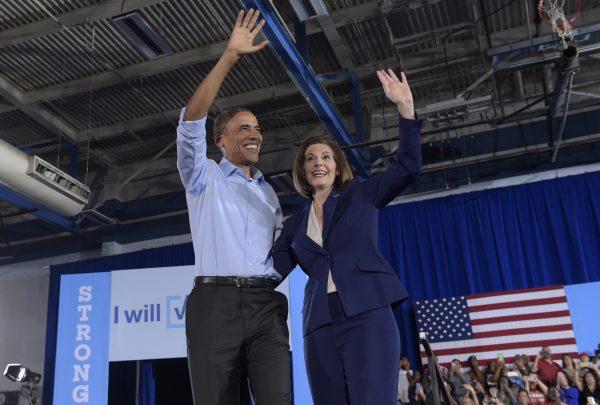President Barack Obama and then-candidate Catherine Cortez-Masto wave to the crowd during an event in Las Vegas in 2016. (AP Photo/Susan Walsh)