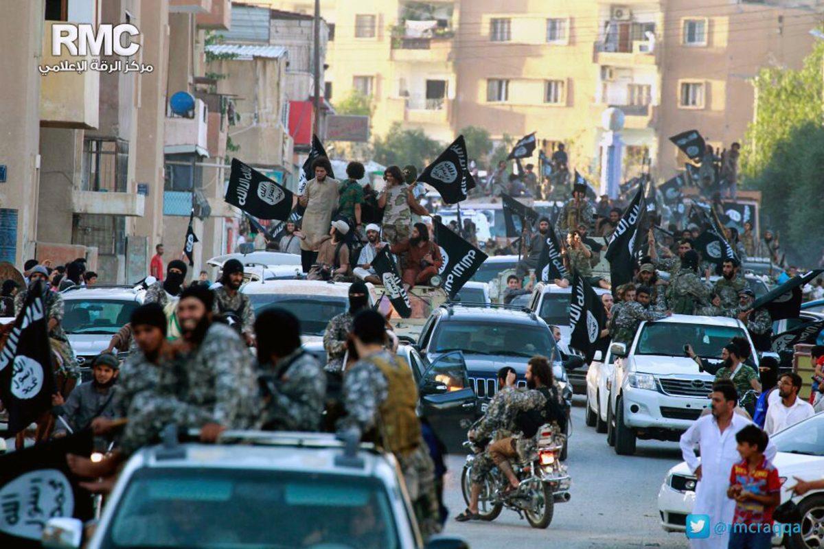 ISIS terrorists parade in Raqqa, Syria, which serves as their de facto capital, on<br/>June 30, 2014.<br/>(AP Photo/Raqqa Media Center of the Islamic State group)
